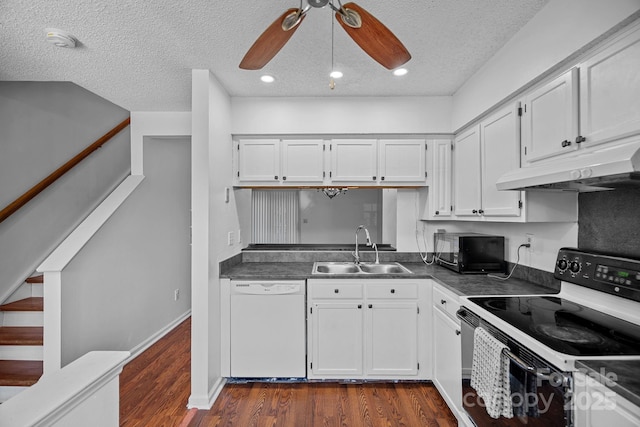 218 Water Oak Dr, Pineville, NC 28134 - kitchen with white appliances, under cabinet range hood, dark countertops, a textured ceiling, and white cabinetry