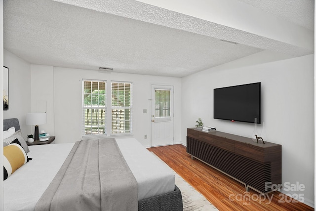 218 Water Oak Dr, Pineville, NC 28134 - bedroom with wood finished floors and a textured ceiling