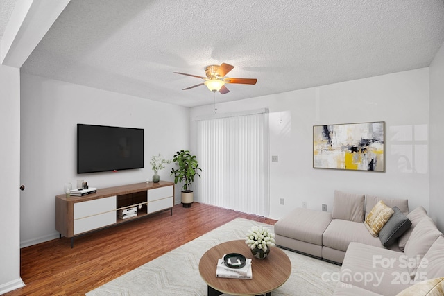 218 Water Oak Dr, Pineville, NC 28134 - living area featuring wood finished floors, ceiling fan, and a textured ceiling