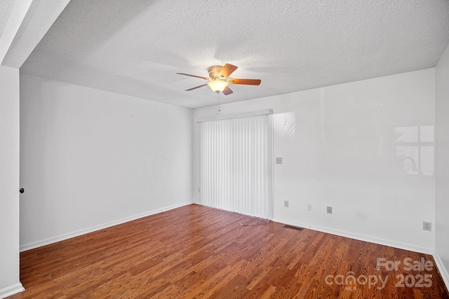 218 Water Oak Dr, Pineville, NC 28134 - spare room featuring wood finished floors, a ceiling fan, and a textured ceiling
