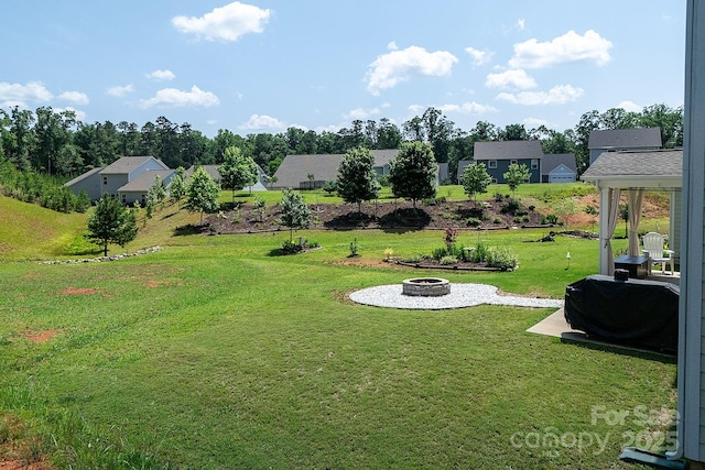 171 Old Harbor Dr, Mount Gilead, NC 27306 - view of green lawn with an outdoor fire pit