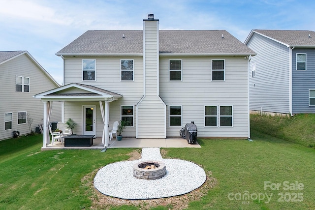 171 Old Harbor Dr, Mount Gilead, NC 27306 - back of house with an outdoor fire pit, a patio, a lawn, and a chimney
