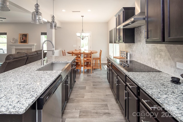 171 Old Harbor Dr, Mount Gilead, NC 27306 - kitchen with wall chimney exhaust hood, black electric stovetop, dishwasher, open floor plan, and light wood finished floors