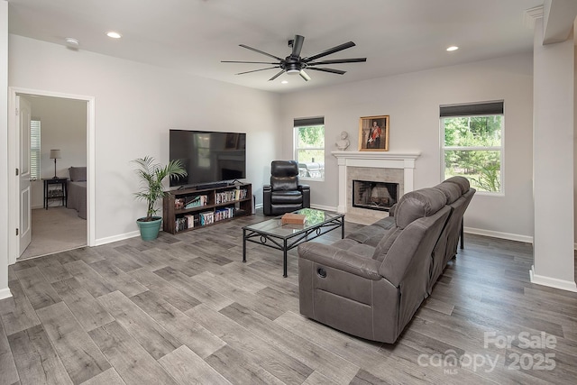 171 Old Harbor Dr, Mount Gilead, NC 27306 - living area featuring plenty of natural light, a tile fireplace, ceiling fan, wood finished floors, and recessed lighting