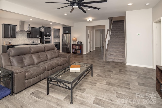 171 Old Harbor Dr, Mount Gilead, NC 27306 - living room featuring ceiling fan, light wood finished floors, stairway, and recessed lighting