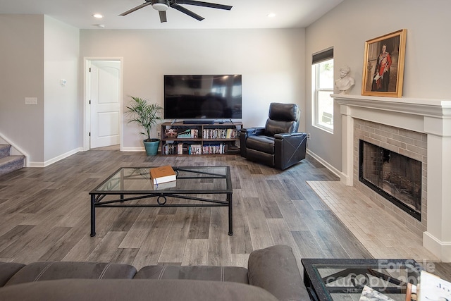 171 Old Harbor Dr, Mount Gilead, NC 27306 - living area featuring a ceiling fan, wood finished floors, a brick fireplace, stairs, and recessed lighting