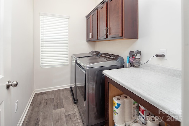 171 Old Harbor Dr, Mount Gilead, NC 27306 - washroom with cabinet space, wood finished floors, and washing machine and dryer