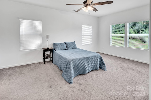 171 Old Harbor Dr, Mount Gilead, NC 27306 - carpeted bedroom with baseboards and a ceiling fan