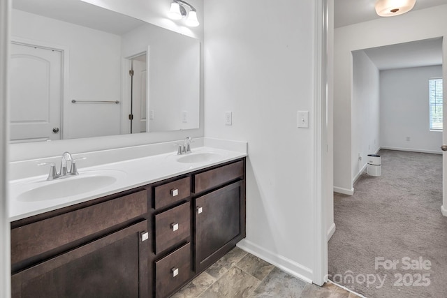 171 Old Harbor Dr, Mount Gilead, NC 27306 - bathroom featuring double vanity and baseboards
