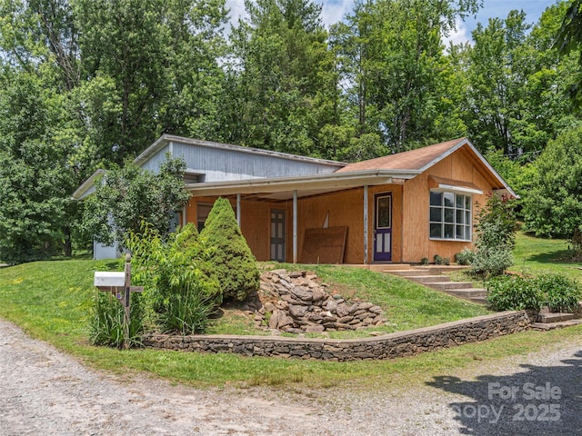 157 Evergreen Cir, Waynesville, NC 28786 - view of front of house with an attached carport and a front lawn