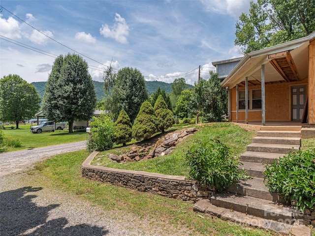 157 Evergreen Cir, Waynesville, NC 28786 - view of grassy yard featuring covered porch and driveway