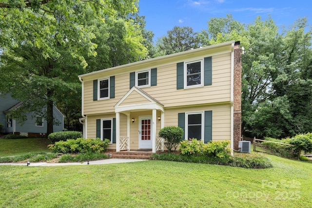 906 Wishing Well Ln, Charlotte, NC 28270 - colonial inspired home with a front yard and a chimney