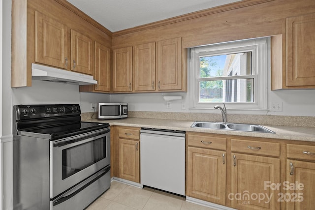 906 Wishing Well Ln, Charlotte, NC 28270 - kitchen featuring stainless steel appliances, under cabinet range hood, light countertops, and light tile patterned floors