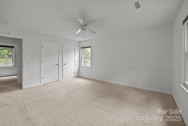 906 Wishing Well Ln, Charlotte, NC 28270 - unfurnished bedroom with carpet flooring, ceiling fan, and multiple closets