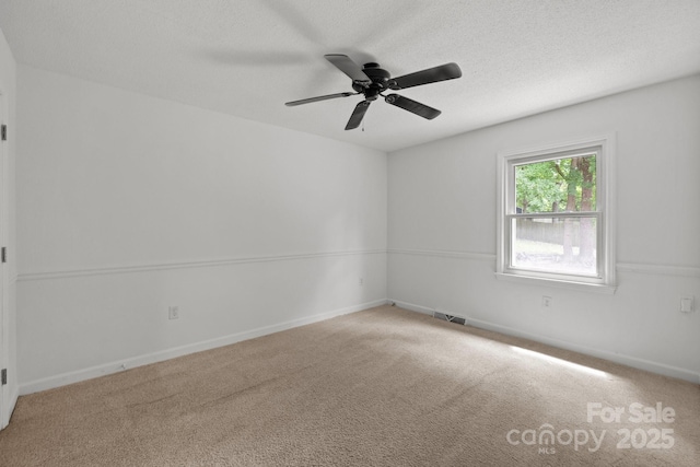 906 Wishing Well Ln, Charlotte, NC 28270 - empty room featuring carpet floors, a ceiling fan, and a textured ceiling