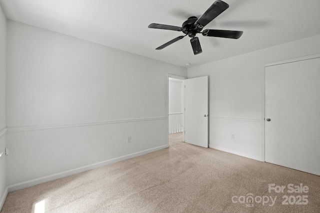 906 Wishing Well Ln, Charlotte, NC 28270 - unfurnished bedroom featuring carpet flooring and a ceiling fan