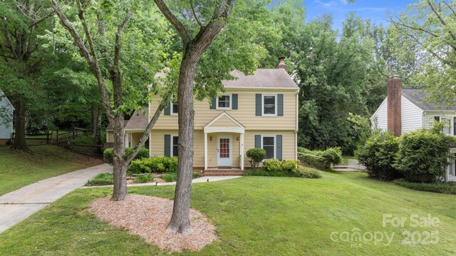 906 Wishing Well Ln, Charlotte, NC 28270 - colonial-style house featuring a chimney