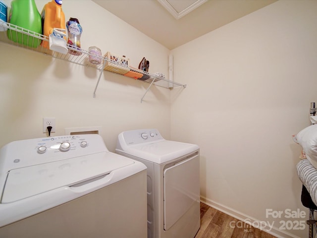 5121 Arbordale Way, Mount Holly, NC 28120 - laundry room with wood finished floors and washer and clothes dryer
