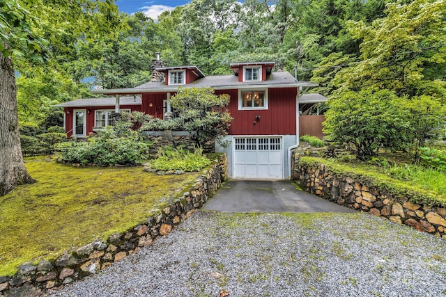 60 Meeks Rd, Black Mountain, NC 28711 - view of front of house featuring gravel driveway, an attached garage, and a chimney