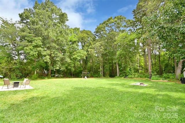 339 Brown Rd, China Grove, NC 28023 - view of green lawn with an outdoor fire pit and a patio area