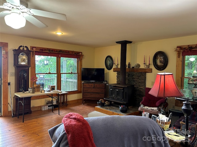 687 Willow Creek Rd, Leicester, NC 28748 - living area with a wood stove, hardwood / wood-style floors, and ceiling fan