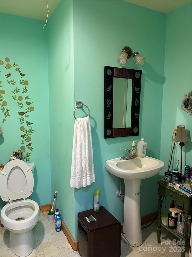 687 Willow Creek Rd, Leicester, NC 28748 - bathroom with baseboards and toilet