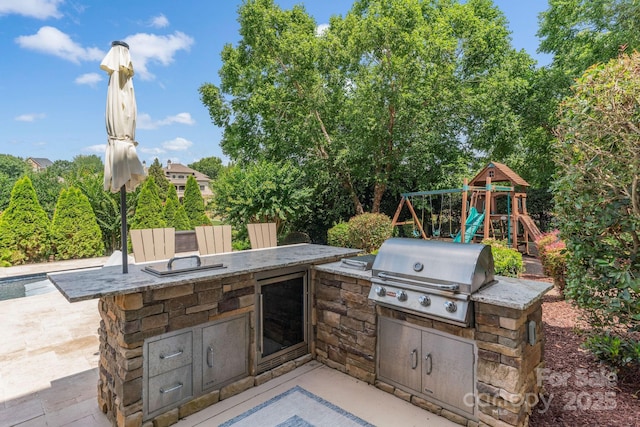 1032 Spyglass Ln, Waxhaw, NC 28173 - view of patio / terrace featuring area for grilling and a playground