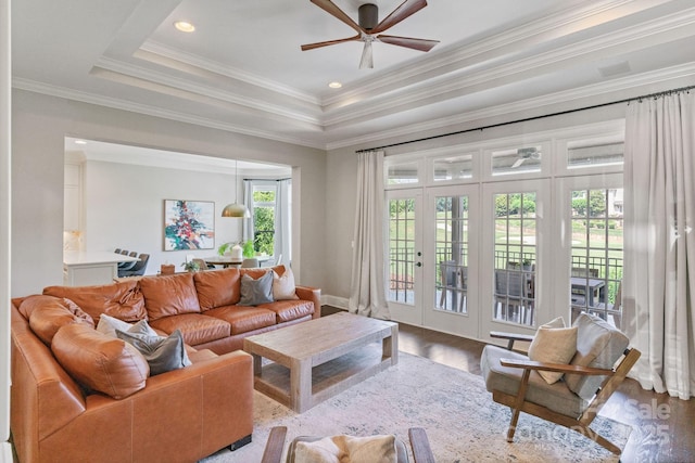 1032 Spyglass Ln, Waxhaw, NC 28173 - living area with french doors, a ceiling fan, wood finished floors, a raised ceiling, and ornamental molding