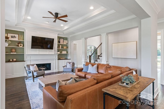 1032 Spyglass Ln, Waxhaw, NC 28173 - living area with ceiling fan, dark wood-style floors, a fireplace, crown molding, and a raised ceiling