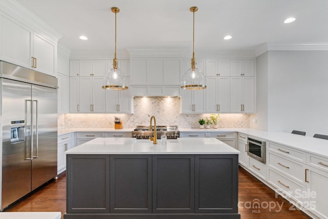 1032 Spyglass Ln, Waxhaw, NC 28173 - kitchen with built in refrigerator, light countertops, dark wood-style floors, white cabinetry, and crown molding