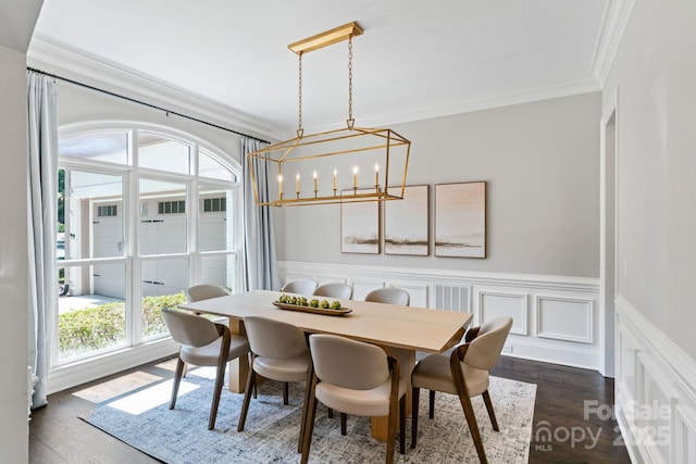 1032 Spyglass Ln, Waxhaw, NC 28173 - dining space with crown molding, a chandelier, wainscoting, and dark wood finished floors