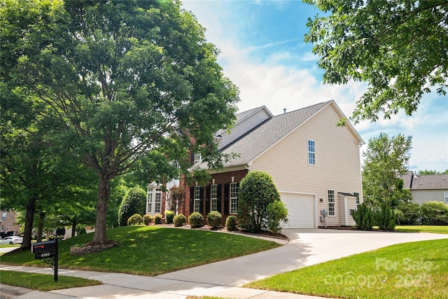 6803 Augustine Way, Charlotte, NC 28270 - view of front facade with concrete driveway, a front yard, and a garage