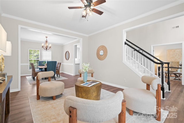 6803 Augustine Way, Charlotte, NC 28270 - living room featuring a chandelier, dark wood-style flooring, ornamental molding, stairway, and ceiling fan