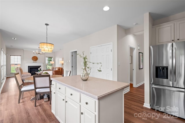 6803 Augustine Way, Charlotte, NC 28270 - kitchen with stainless steel fridge, dark wood-style flooring, a center island, light countertops, and open floor plan