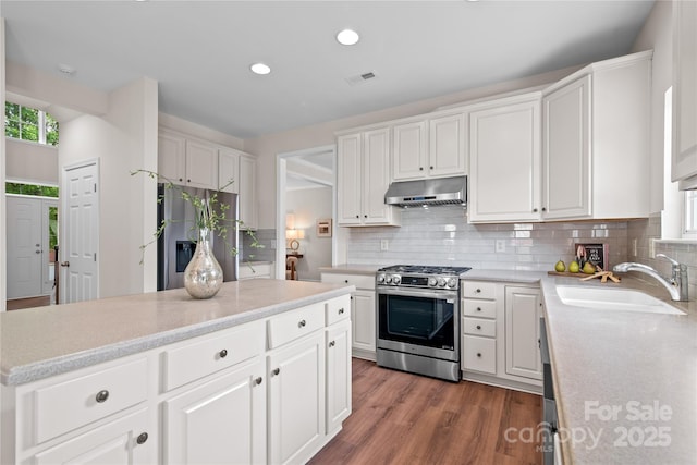 6803 Augustine Way, Charlotte, NC 28270 - kitchen featuring appliances with stainless steel finishes, under cabinet range hood, recessed lighting, light countertops, and white cabinetry