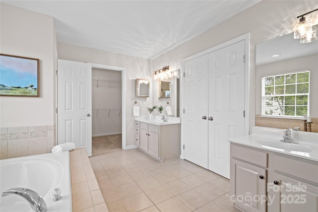 6803 Augustine Way, Charlotte, NC 28270 - bathroom with two vanities, a garden tub, and tile patterned floors