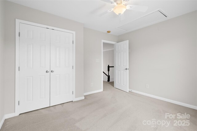 6803 Augustine Way, Charlotte, NC 28270 - unfurnished bedroom with light carpet, attic access, a closet, and ceiling fan