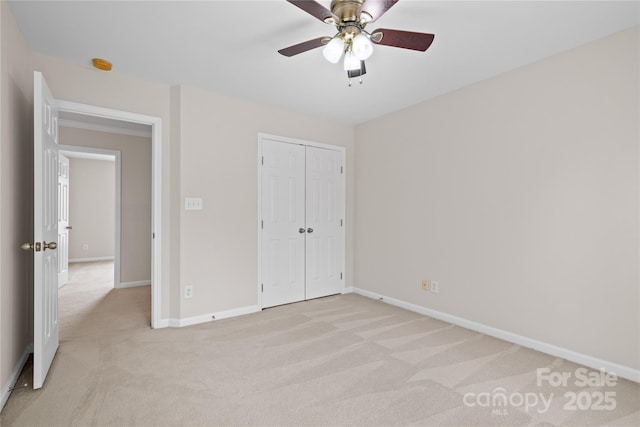 6803 Augustine Way, Charlotte, NC 28270 - unfurnished bedroom featuring light carpet, a closet, and ceiling fan