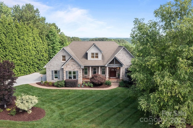 753 River Bend Dr, Granite Falls, NC 28630 - view of front of property featuring stone siding, a front lawn, and covered porch