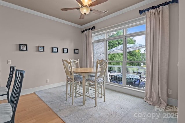 753 River Bend Dr, Granite Falls, NC 28630 - dining space featuring wood finished floors, crown molding, and a ceiling fan