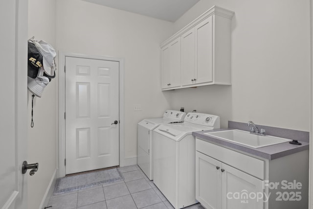 753 River Bend Dr, Granite Falls, NC 28630 - washroom featuring cabinet space, washer and dryer, and light tile patterned floors