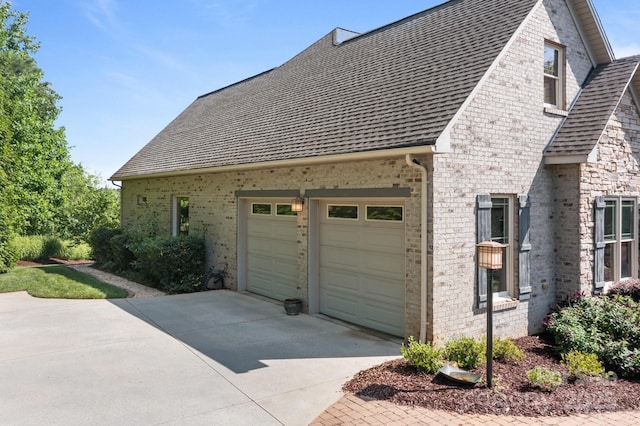 753 River Bend Dr, Granite Falls, NC 28630 - view of property exterior featuring concrete driveway, brick siding, a garage, and a shingled roof