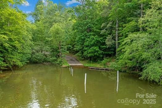753 River Bend Dr, Granite Falls, NC 28630 - dock area featuring a wooded view and a water view