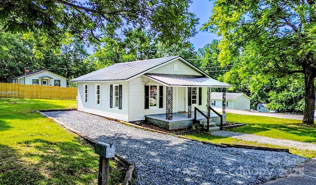 106 Cedar St, Spindale, NC 28160 - view of front of house with covered porch and metal roof