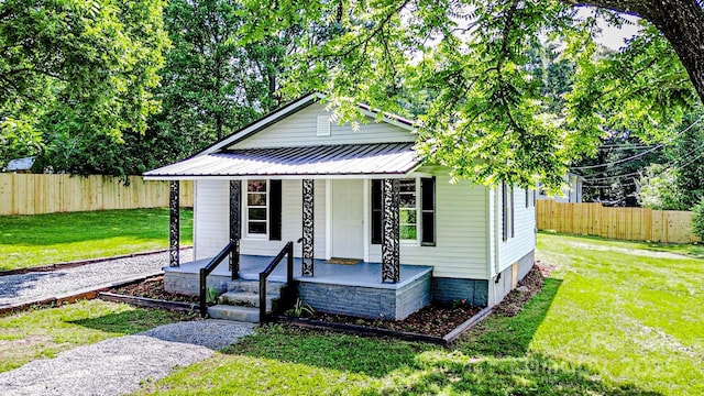 106 Cedar St, Spindale, NC 28160 - view of front of property with covered porch and metal roof