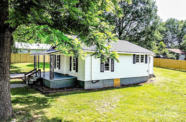 106 Cedar St, Spindale, NC 28160 - view of side of property featuring covered porch, crawl space, and metal roof