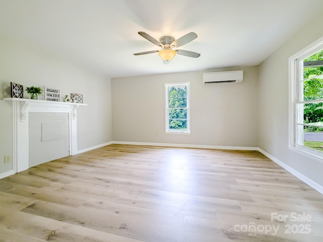 106 Cedar St, Spindale, NC 28160 - spare room featuring a wall unit AC, wood finished floors, and baseboards