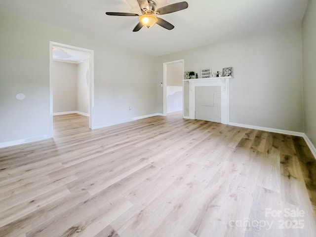 106 Cedar St, Spindale, NC 28160 - unfurnished room with light wood finished floors, ceiling fan, and baseboards