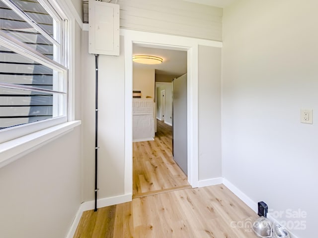 106 Cedar St, Spindale, NC 28160 - corridor with light wood-style flooring, baseboards, and electric panel