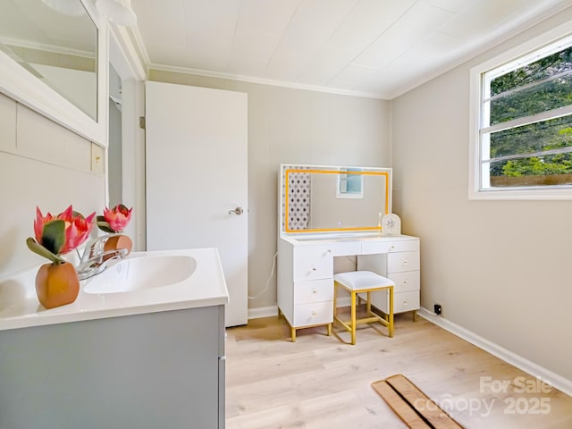 106 Cedar St, Spindale, NC 28160 - bathroom with wood finished floors, vanity, ornamental molding, and baseboards